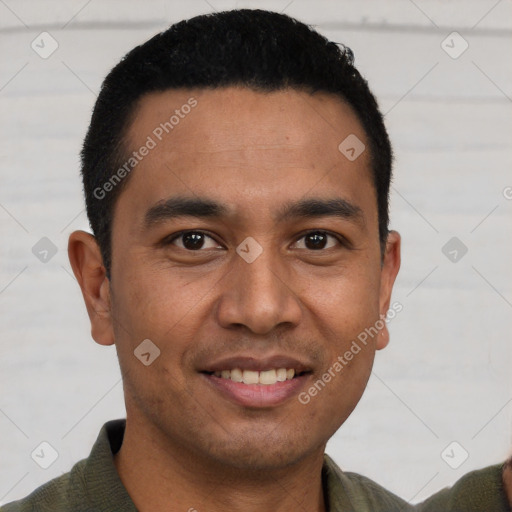 Joyful white young-adult male with short  black hair and brown eyes