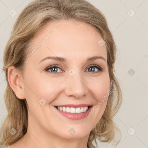 Joyful white young-adult female with medium  brown hair and blue eyes