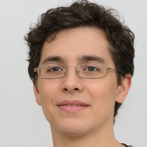 Joyful white young-adult male with short  brown hair and green eyes