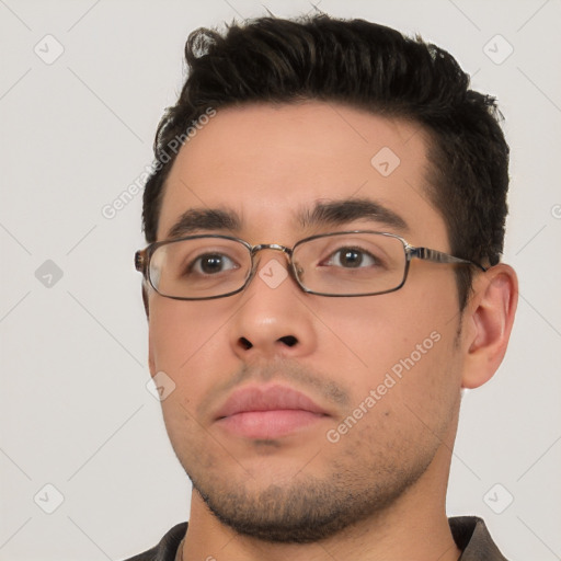 Neutral white young-adult male with short  brown hair and brown eyes