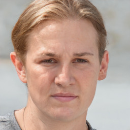 Joyful white adult male with short  brown hair and grey eyes