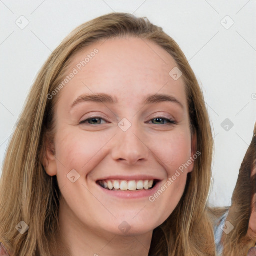 Joyful white young-adult female with long  brown hair and blue eyes