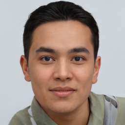 Joyful asian young-adult male with short  brown hair and brown eyes