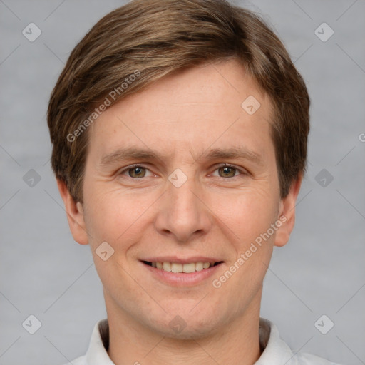 Joyful white adult male with short  brown hair and grey eyes