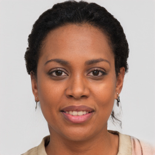 Joyful latino young-adult female with short  black hair and brown eyes