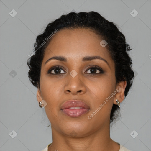 Joyful black young-adult female with medium  brown hair and brown eyes