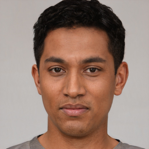 Neutral latino young-adult male with short  black hair and brown eyes