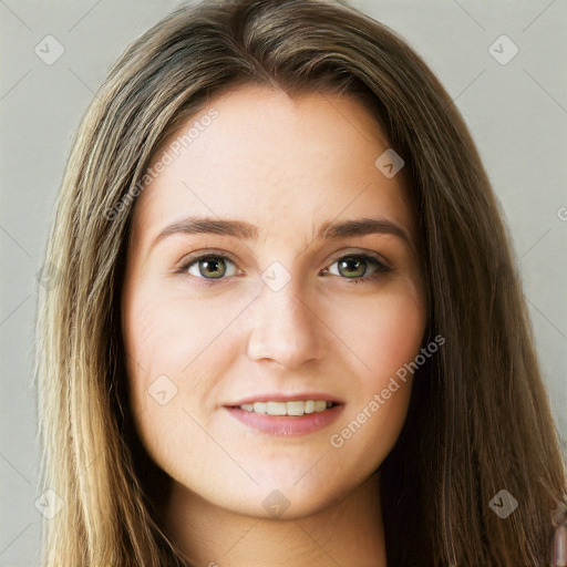 Joyful white young-adult female with long  brown hair and green eyes