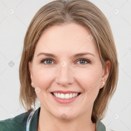 Joyful white young-adult female with medium  brown hair and green eyes