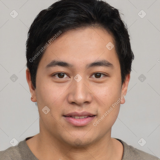 Joyful asian young-adult male with short  brown hair and brown eyes