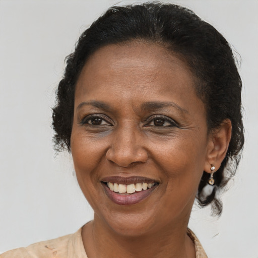 Joyful latino adult female with short  brown hair and brown eyes