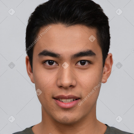 Joyful asian young-adult male with short  black hair and brown eyes