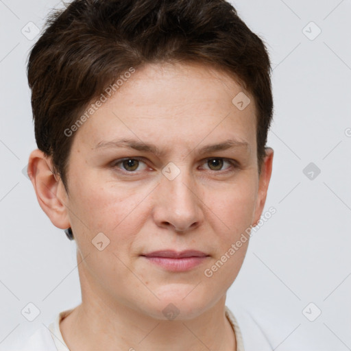 Joyful white young-adult female with short  brown hair and grey eyes