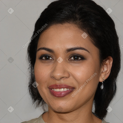 Joyful latino young-adult female with medium  brown hair and brown eyes