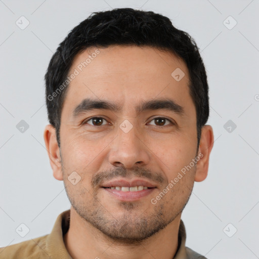 Joyful latino young-adult male with short  black hair and brown eyes