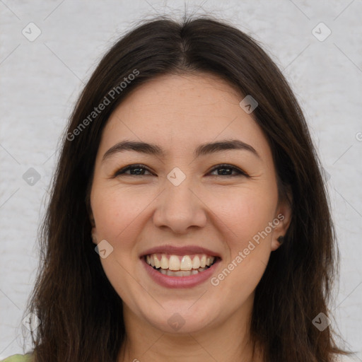 Joyful white young-adult female with long  brown hair and brown eyes