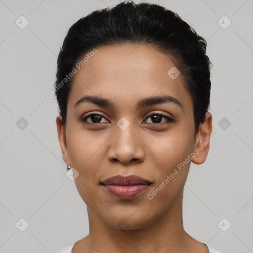 Joyful latino young-adult female with short  black hair and brown eyes