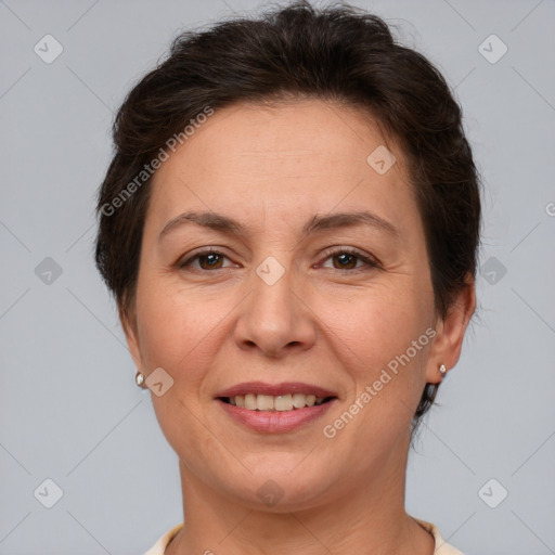 Joyful white adult female with short  brown hair and brown eyes