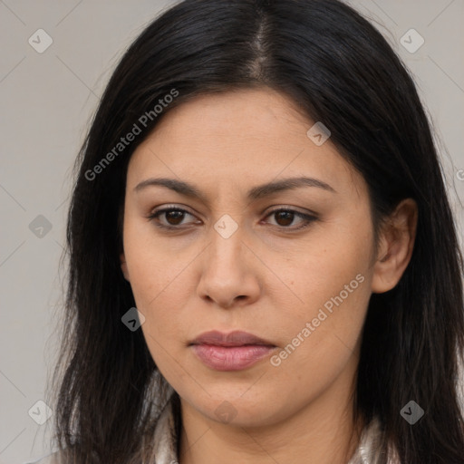 Joyful latino young-adult female with long  brown hair and brown eyes