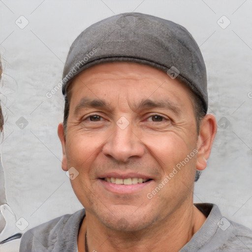 Joyful white adult male with short  black hair and brown eyes