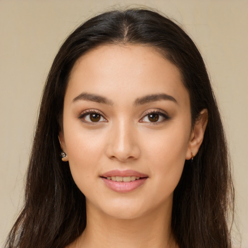 Joyful white young-adult female with long  brown hair and brown eyes