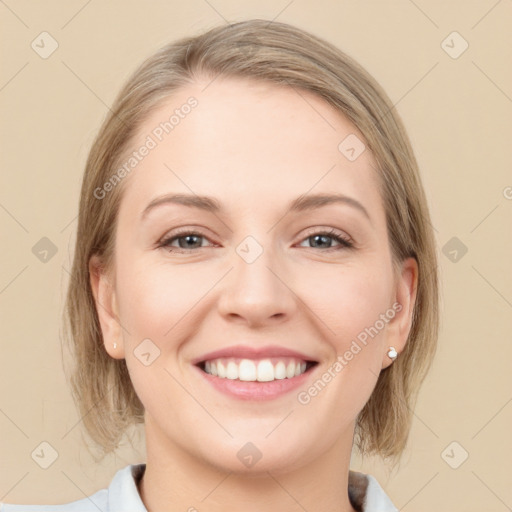 Joyful white young-adult female with medium  brown hair and grey eyes