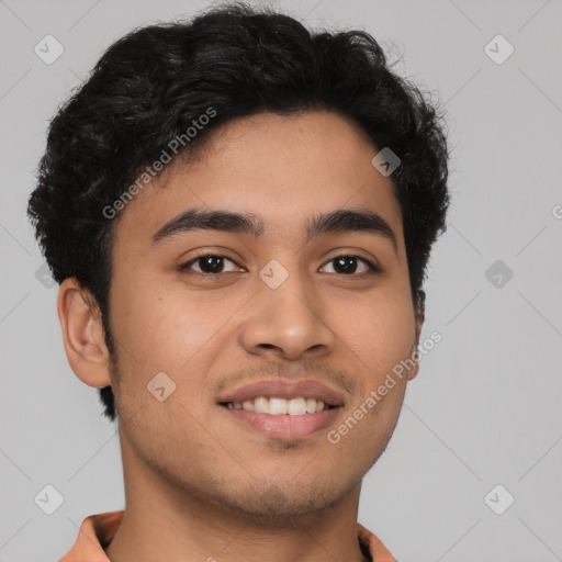 Joyful latino young-adult male with short  brown hair and brown eyes