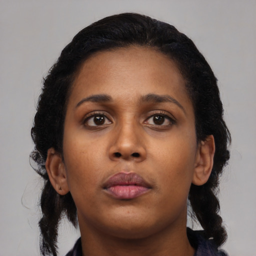 Neutral black young-adult female with medium  black hair and brown eyes