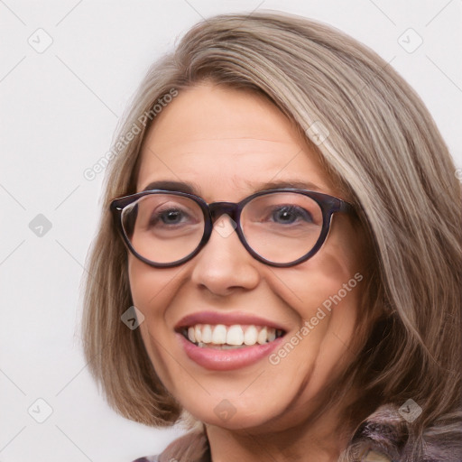 Joyful white adult female with medium  brown hair and blue eyes