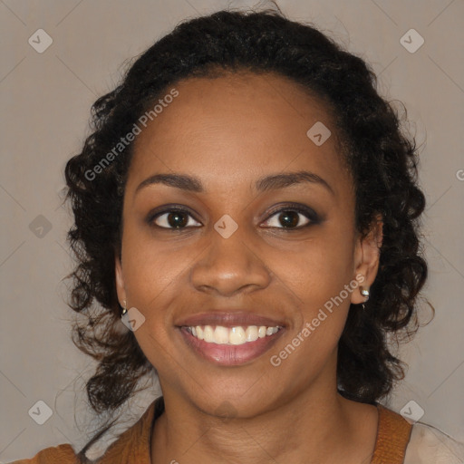 Joyful black young-adult female with medium  brown hair and brown eyes