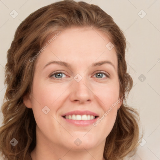 Joyful white young-adult female with long  brown hair and blue eyes