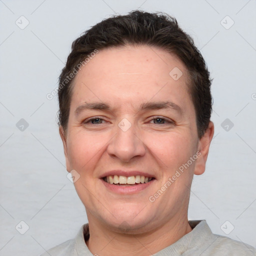 Joyful white adult female with short  brown hair and brown eyes