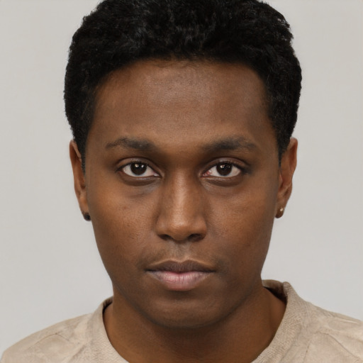Neutral black young-adult male with short  black hair and brown eyes