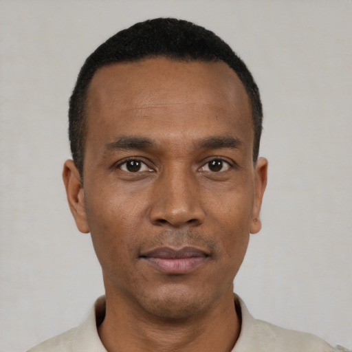 Neutral black young-adult male with short  black hair and brown eyes