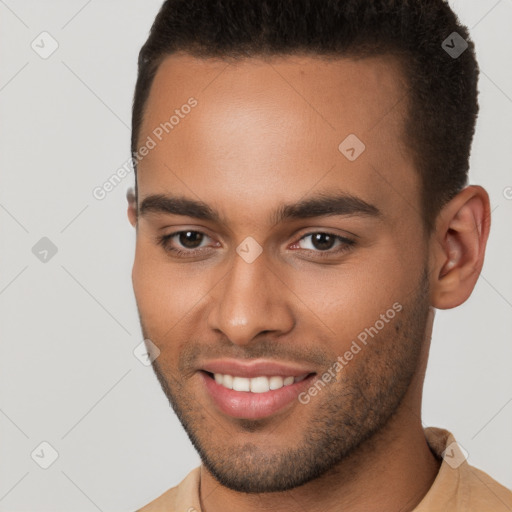 Joyful white young-adult male with short  brown hair and brown eyes