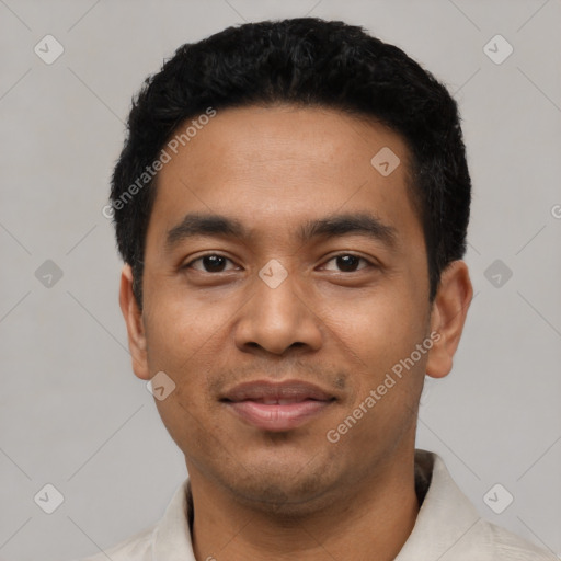 Joyful latino young-adult male with short  black hair and brown eyes