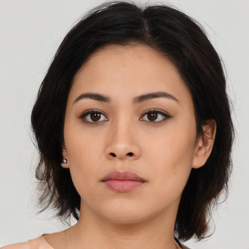 Neutral asian young-adult female with medium  brown hair and brown eyes