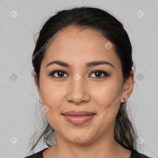 Joyful latino young-adult female with medium  brown hair and brown eyes