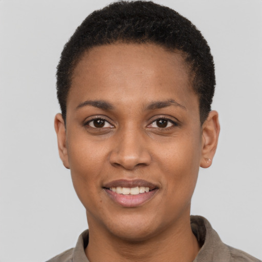 Joyful black young-adult female with short  brown hair and brown eyes