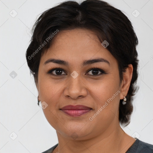 Joyful latino young-adult female with medium  brown hair and brown eyes