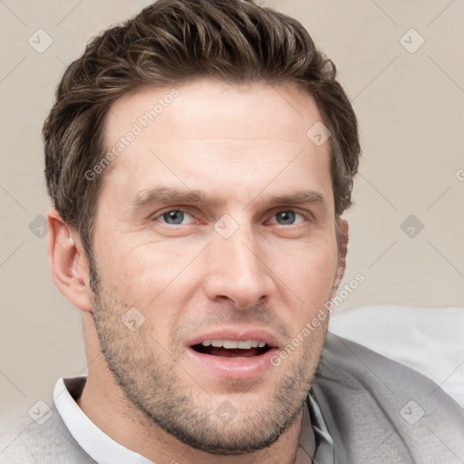 Joyful white adult male with short  brown hair and grey eyes