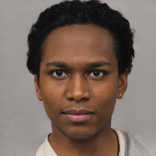 Neutral black young-adult male with short  black hair and brown eyes