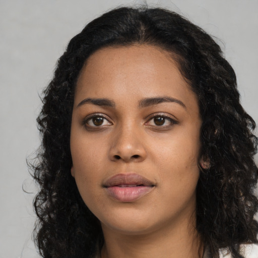 Neutral latino young-adult female with long  black hair and brown eyes