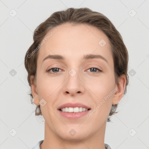 Joyful white young-adult female with medium  brown hair and grey eyes