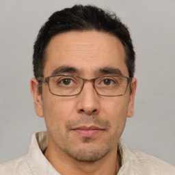Neutral white adult male with short  black hair and brown eyes