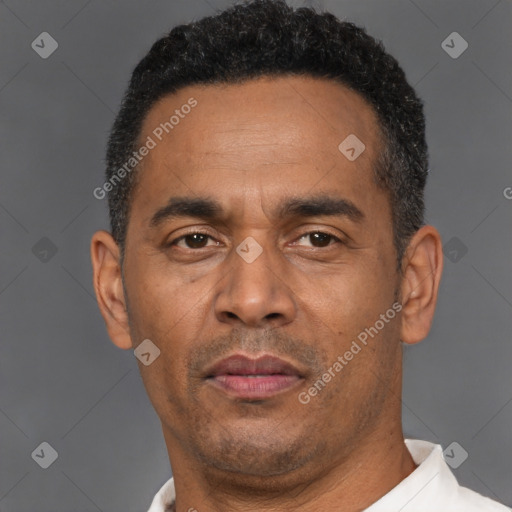 Neutral latino adult male with short  black hair and brown eyes