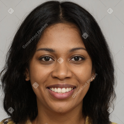 Joyful black young-adult female with long  brown hair and brown eyes