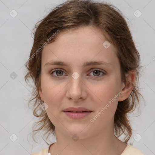 Joyful white young-adult female with medium  brown hair and green eyes