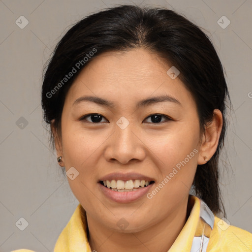 Joyful asian young-adult female with medium  brown hair and brown eyes