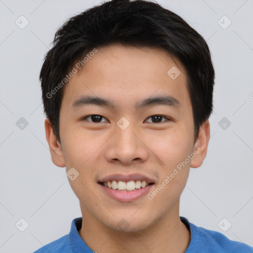 Joyful asian young-adult male with short  brown hair and brown eyes